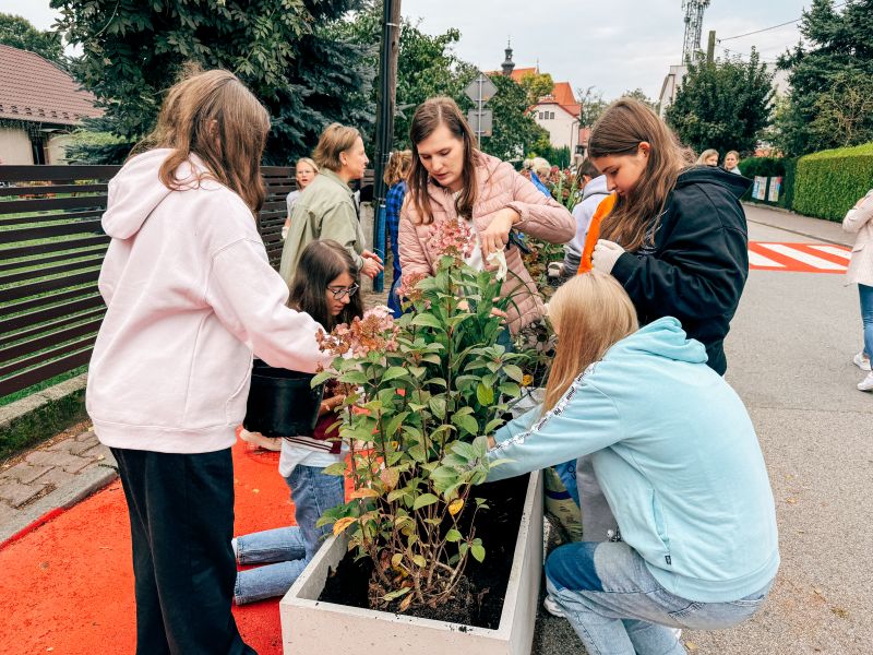 A group of people gardening together