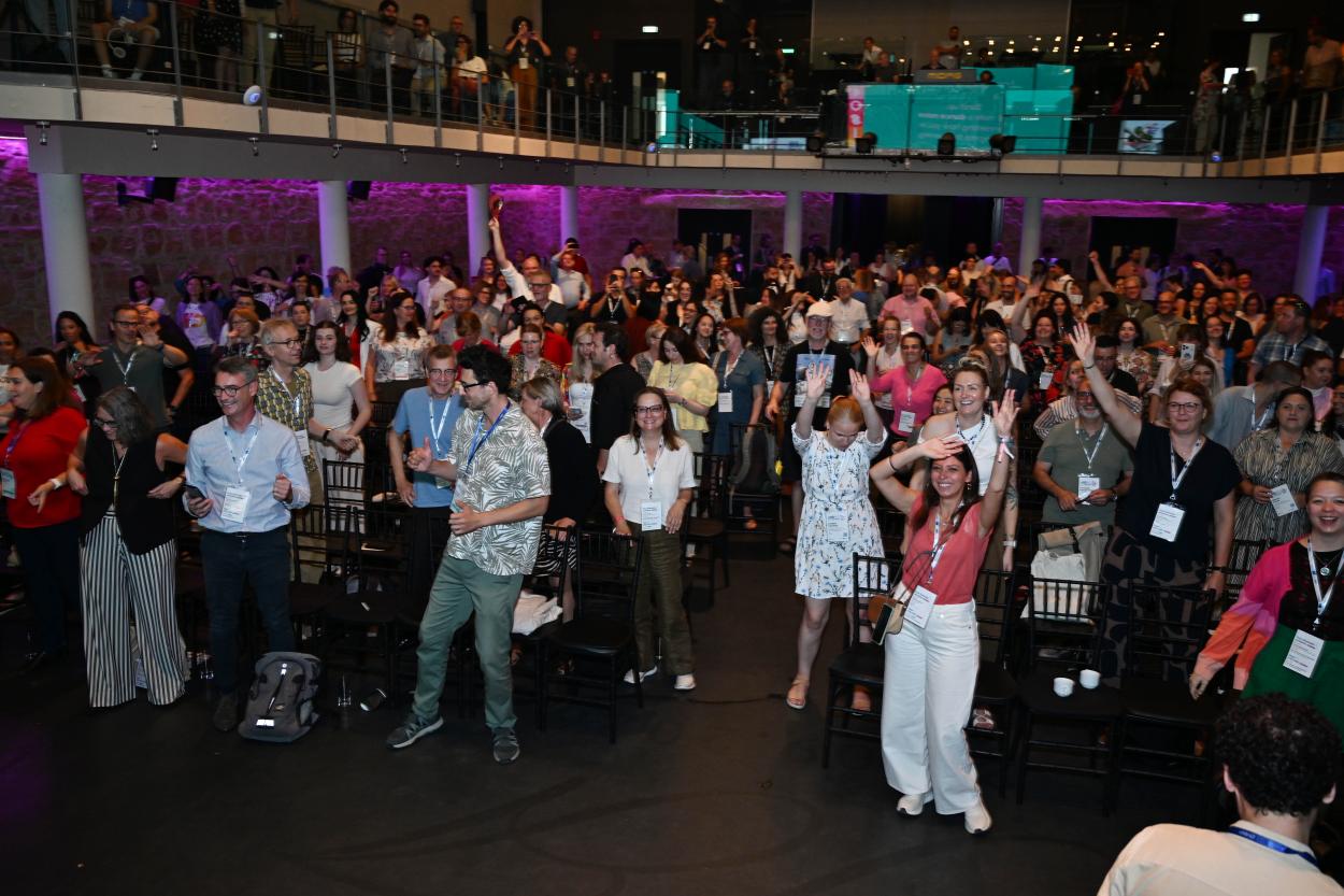 Participants dancing in conference room