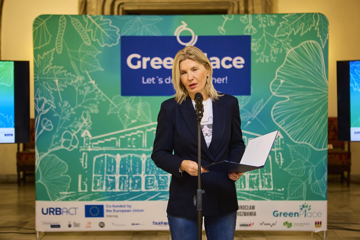 Deputy Mayor of Wrocław speaking in from of the GreenPlace project backdrop.