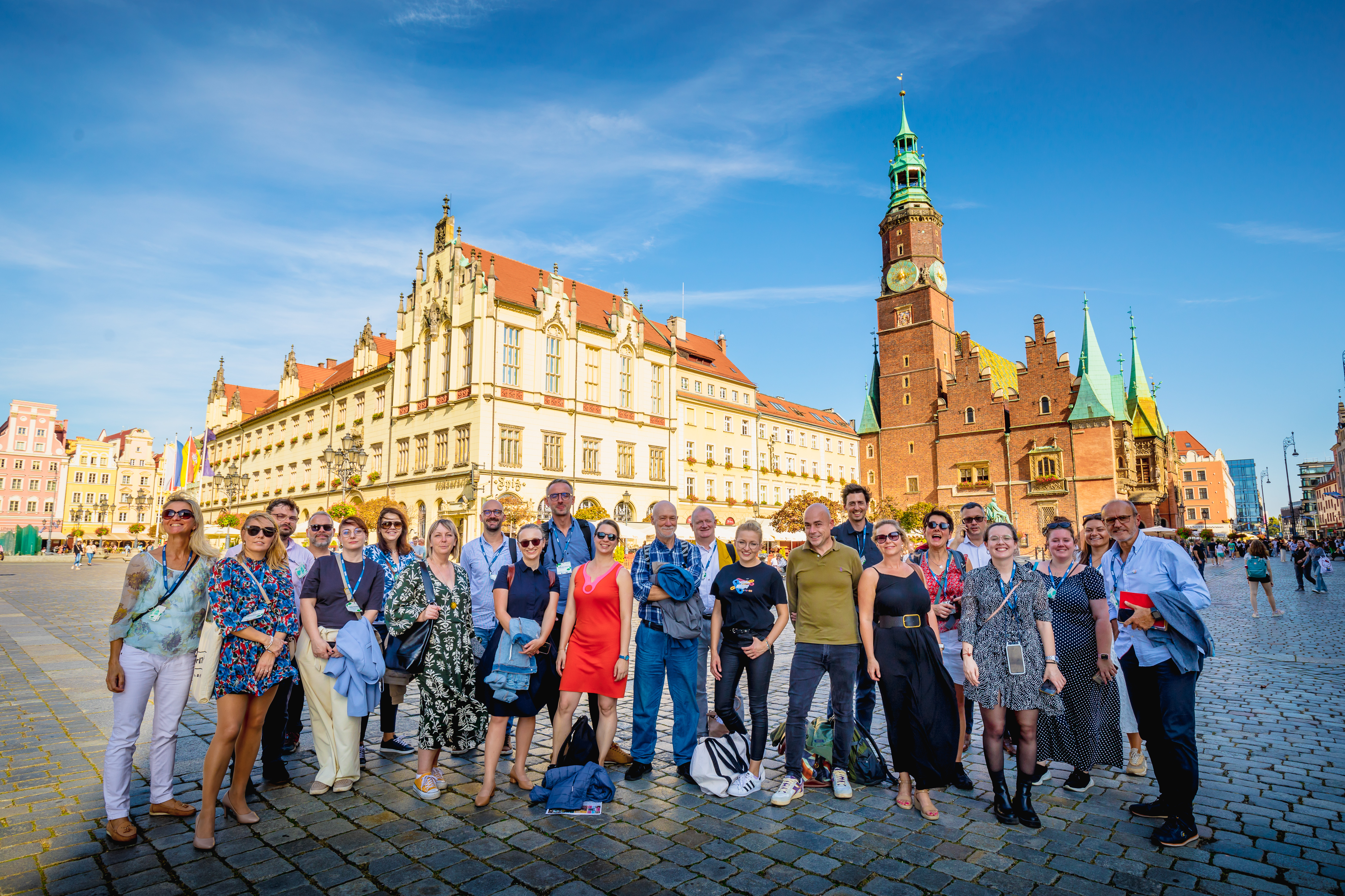 a group of people standing on the Market Square in Wrocław