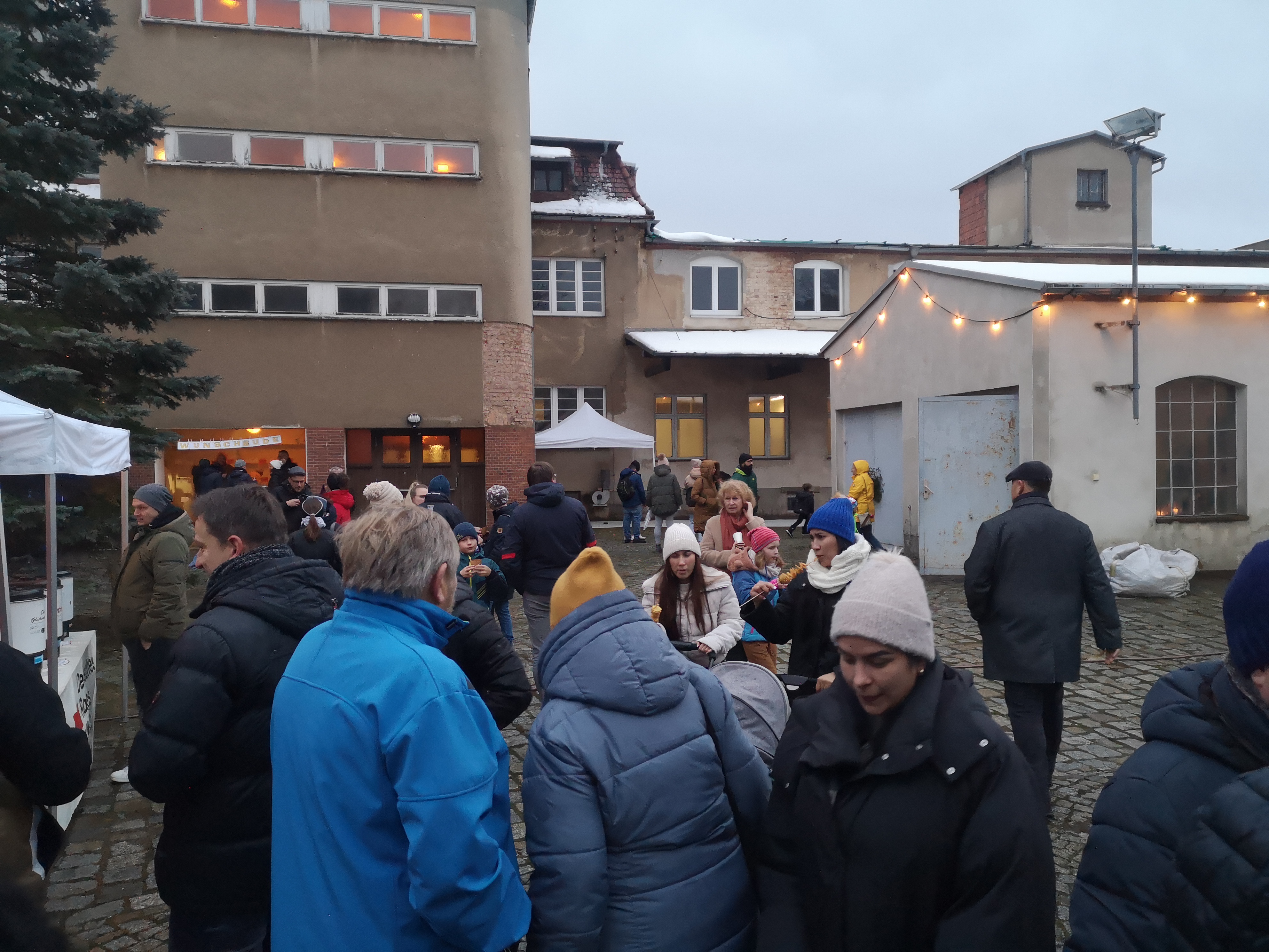 people on the courtyard of Schminke pasta factory