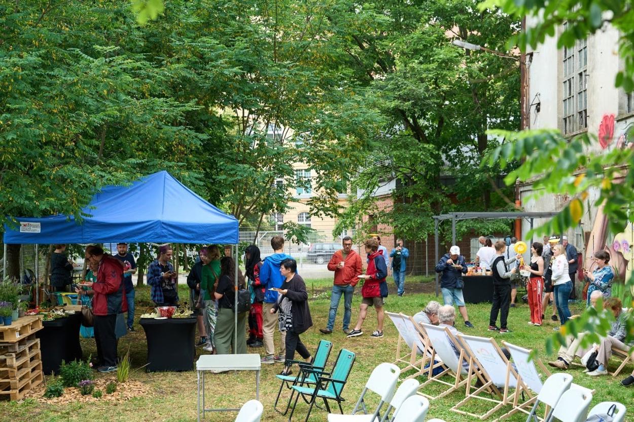 A group of people gathered at the opening event.