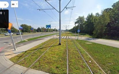 Kosmonautów street tramline after greening (2024). Photo credits: Google Street view 
