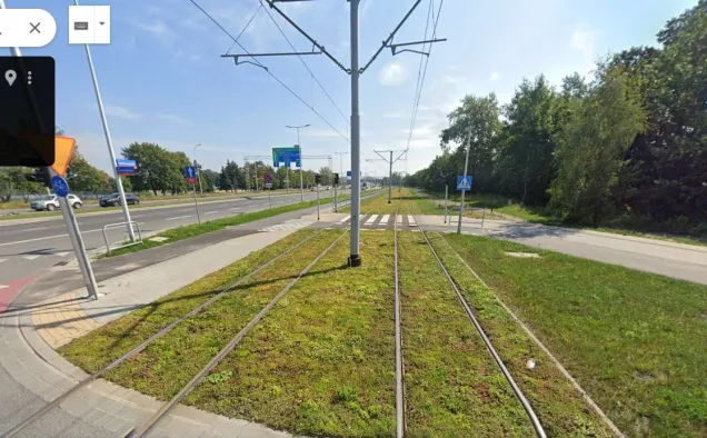 Kosmonautów street tramline after greening (2024). Photo credits: Google Street view 