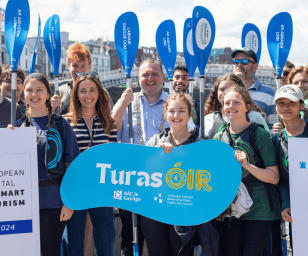 Group of people gathered for an event related to smart tourism in Dublin.