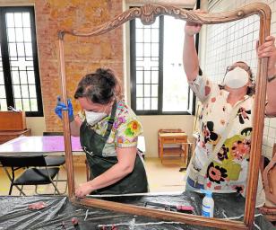 People working on a frame