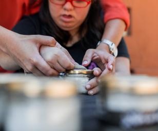 A workshop or a crafting area, suggesting that the person might be involved in some form of artisanal or technical work.