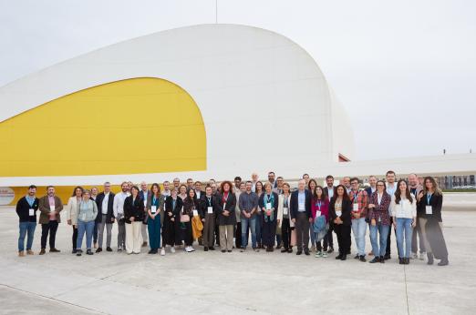 Group picture of +50 attendees to the Kick-off meeting in Avilés in front of a modern building (Niemeyer Center) in Avilés