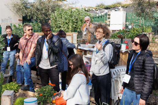 Group of people visiting the urban garden in Mouans-Sartoux (FR). Photo by European Urban Initiative.