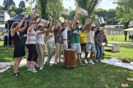 Group of people holding musical instruments in the air