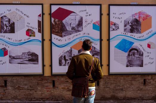 A person looking at infographics on a wall