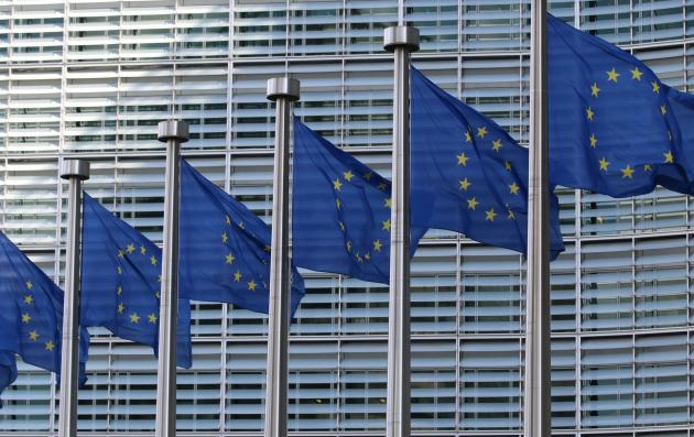 European Union flags at the European Commission Berlaymont building.