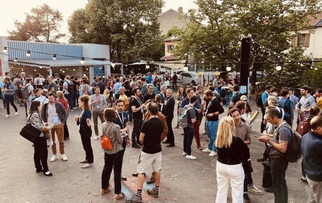 This image depicts a lively outdoor gathering or event, possibly a festival, fair, or market. 