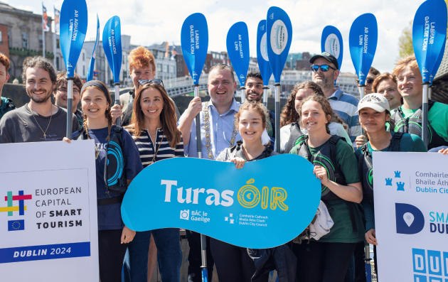 Group of people gathered for an event related to smart tourism in Dublin.