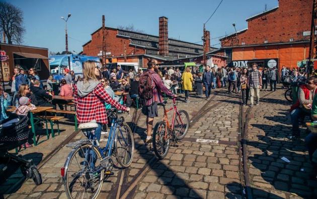 People and children with bicycles