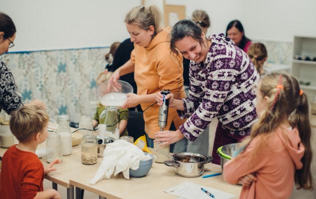 Adults and children cooking together