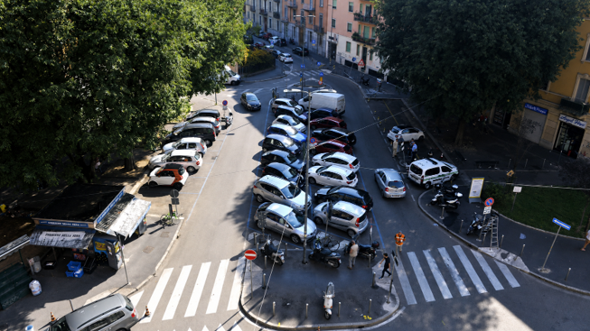 Milan streetscape filled with car parking