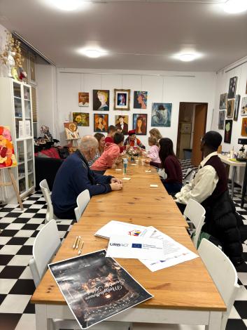 People sitting at a table in a communal living room