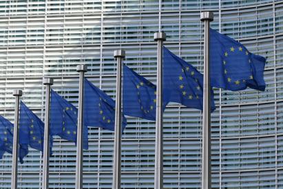 European Union flags at the European Commission Berlaymont building.