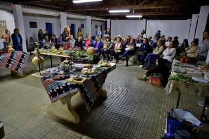 This image depicts an indoor gathering or event, possibly a cultural or community meeting.