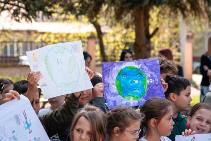 Kids from Berane primary school holding a poster referring to Earth