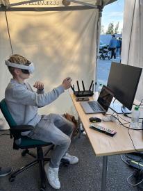 Young person using VR headset with controllers during the Metacity project’s Culture Night activity
