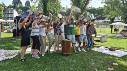 Group of people holding musical instruments in the air