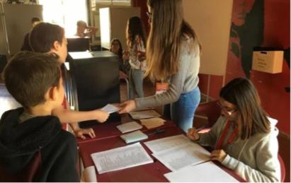 Civic engagement, with young people participating in the democratic process of voting.