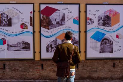 A person looking at infographics on a wall